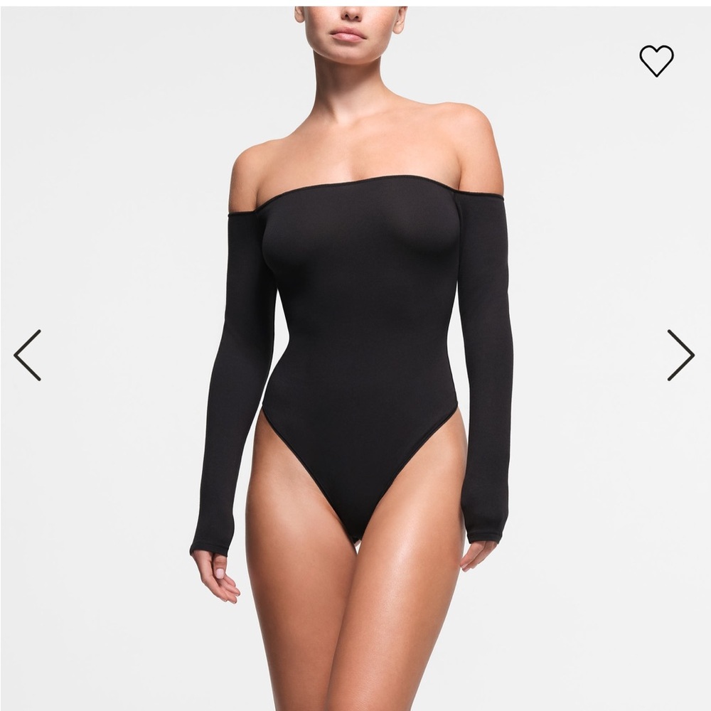 Skims off the shoulder black body suit